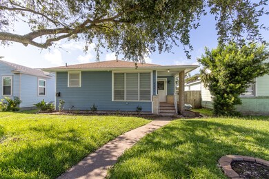 Charming single-story home featuring a covered entryway, freshly painted exterior siding.