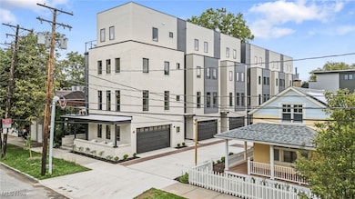 View of property with driveway and an attached garage