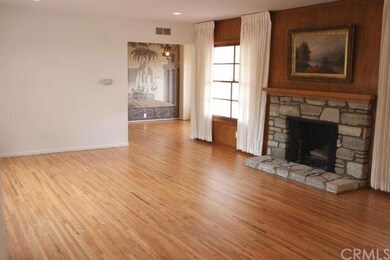 Large living room with fireplace and picture windo
