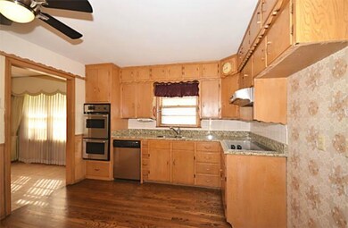 ...Don't miss the double ovens and gorgeous hardwo