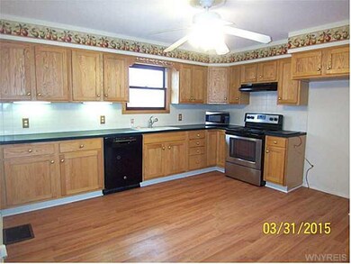 Kitchen. EAT-IN KITCHEN WITH CORIAN COUNTERTOPS.