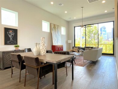 Dining and living room facing Downtown Views