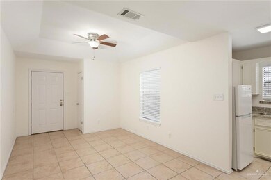 Unfurnished room featuring ceiling fan and light tile patterned floors