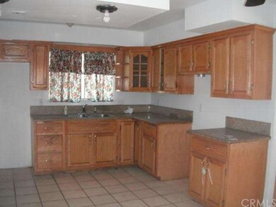 Granite Counter Top, Tile Floor & Oak Cabinets in 