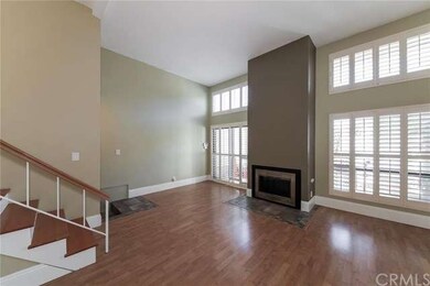 Light, Bright Living Room with Fireplace and Plant