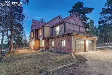 View of side of home featuring stucco siding, driv