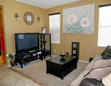 Formal living room with tile entry and pathway to 