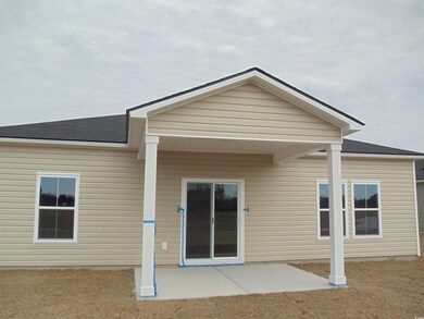 Rear view of property with a patio