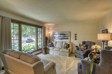 15x13 Bright Living Room off Foyer. Note over-sized Window for the South Sun!