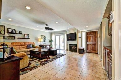 Fireplace and recessed lighting in living room