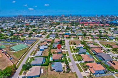 Aerial view featuring a city view, a water view, a