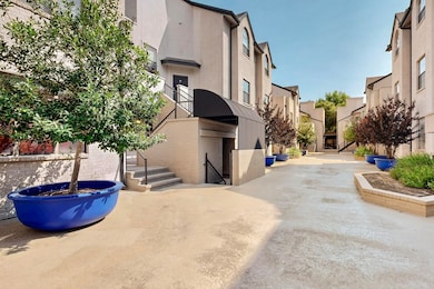 View of concrete road featuring stairs and a residential view