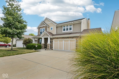 craftsman-style home with stone siding, a chimney, concrete driveway, an attached garage, and a shingled roof