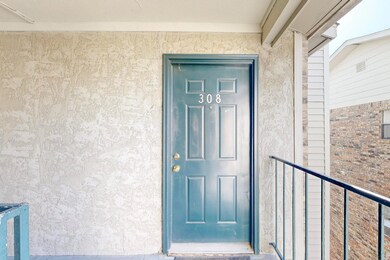 Entrance to property featuring stucco siding