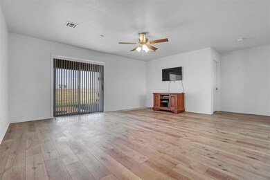 Large Living with Sliding Glass Doors to Back