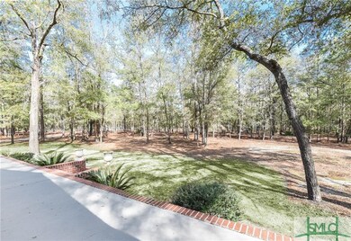 View front the 76 long front porch with brick acce