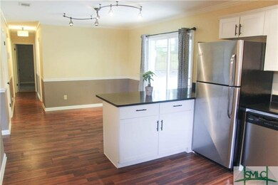 Open living room and dining room area.