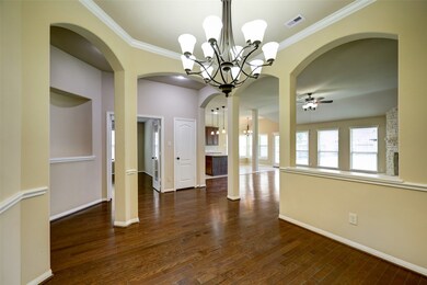 Additional view of formal dinning opened to the living area and kitchen *Pictures are from an identical home in the same neighborhood*