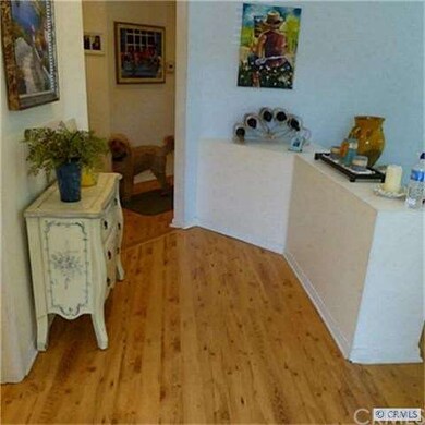 ENTRY HALL WAY TOWARD BEDROOMS SHOWS THE LIGHT LAM