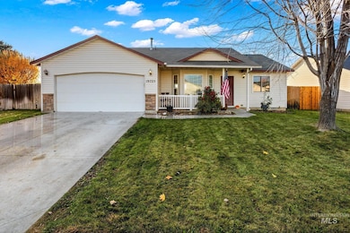 Single story home with a porch, concrete driveway, stone siding, roof with shingles, and an attached garage