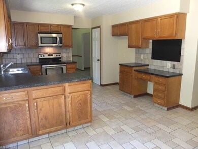 Kitchen has a pantry and built-in desk.