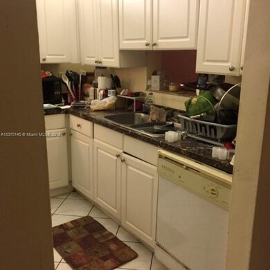 White cabinets and faux granite (formica) counters