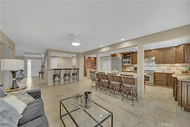 Great Room Incorporates Remodeled Gourmet Granite Kitchen, Family Room, Wrap-Around Entertainer's Wet Bar, and Formal Dining Room
