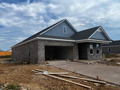 Property in mid-construction with a garage