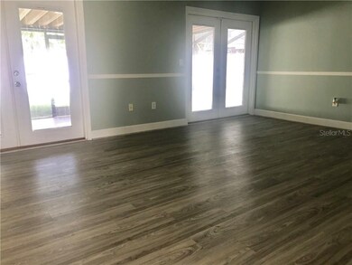 Family Room leading to lanai overlooking the pool