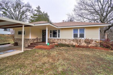 View of front of house with a carport and a front 