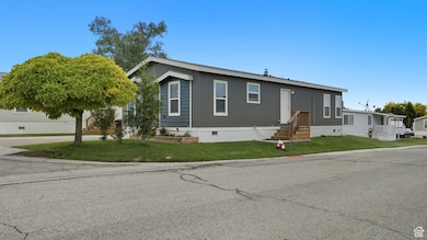 Manufactured / mobile home featuring crawl space and a front yard