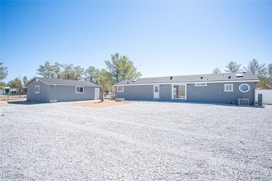 Rear view of property with fence and central AC un