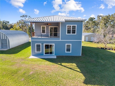 Rear view of the home, 30 x 50 metal building and garages/in-law suite