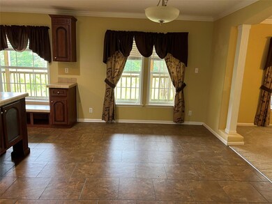 The huge eating area between the living room and k