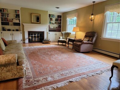 Living room Brick fireplace and built-in bookcases