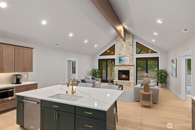 Open concept kitchen & living room. Virtually staged photo.