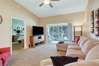 Open concept with volume ceilings and screened-in lanai