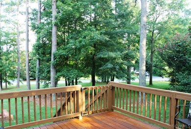 ANOTHER VIEW OF DECK WITH A GLACE TO TH SIDE YARD.