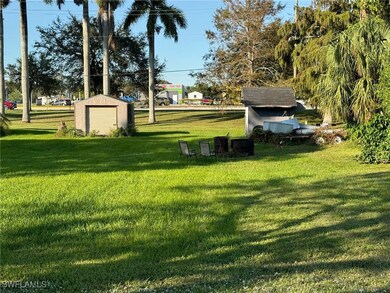 View of yard featuring a storage unit