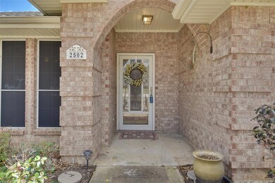The exterior features solar screens, siding, sprinkler system, storm door, recently replaced roof and gutters in addition to a large, treed lot.