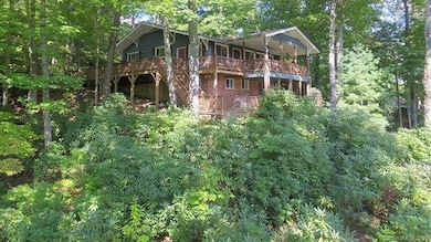 Rear view of residence overlooking Country Club Dr and Golf Course