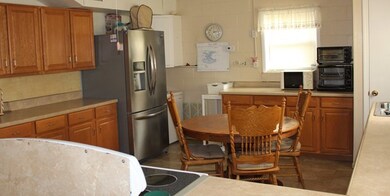 Kitchen with new stainless steel fridge