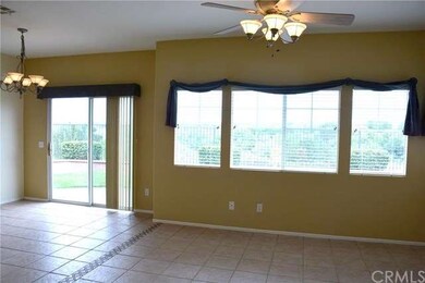 Sliding Glass door to back yard with view.