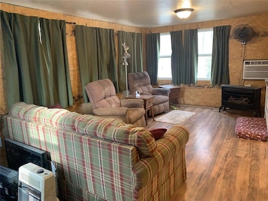Living area with heating unit, a wall mounted AC, 