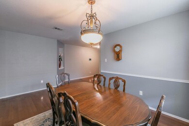 Dining area featuring dark wood-type flooring and 