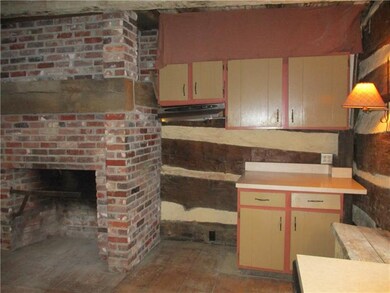 kitchen with brick fireplace