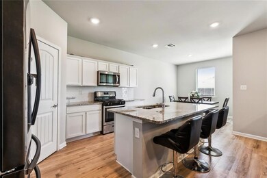 spacious contemporary kitchen with breakfast bar