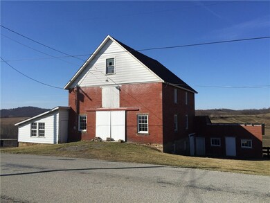 The large barn that is located directly across fro
