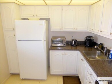 Kitchen on tile and white cabinets