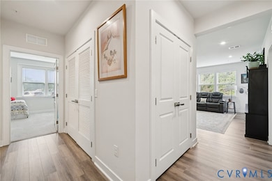 Hallway with light wood-type flooring